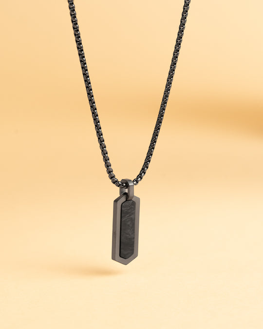 Black stainless steel necklace with a forged carbon finish