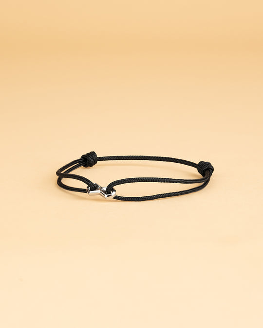 Black nylon bracelet with a silver infinity sign