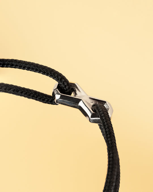 Black nylon bracelet with a silver infinity sign