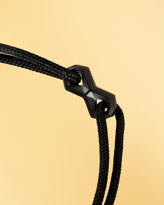 Black nylon bracelet with a black infinity sign