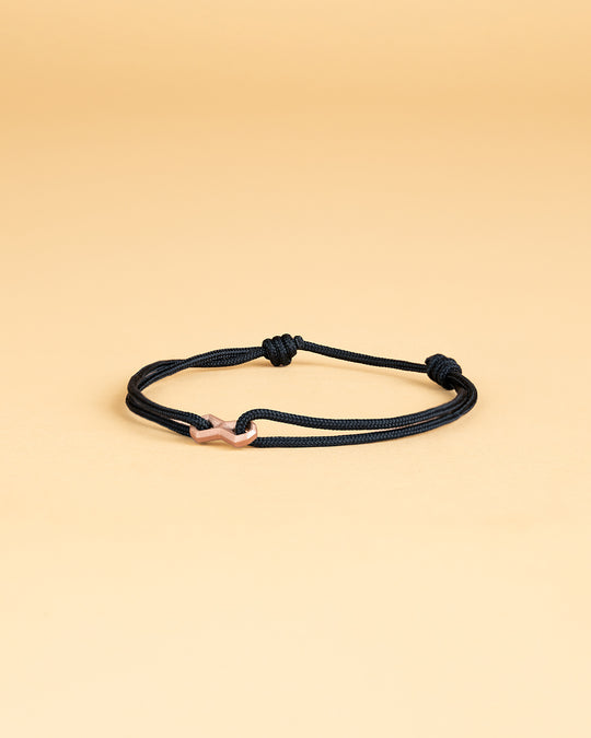 Black nylon bracelet with a gold-plated infinity sign