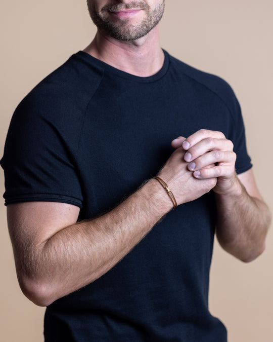 Brown nylon bracelet with a gold-plated infinity sign