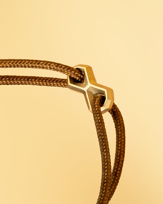 Brown nylon bracelet with a gold-plated infinity sign