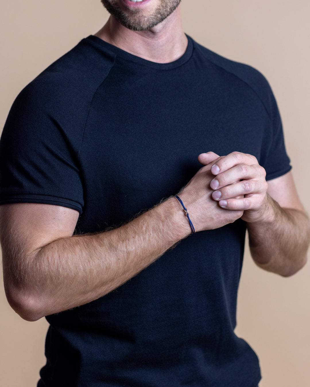 Blue nylon bracelet with a silver-plated infinity sign