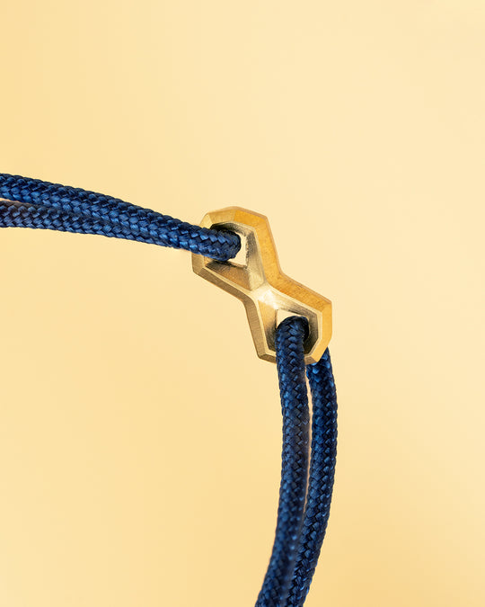 Blue nylon bracelet with a gold-plated infinity sign