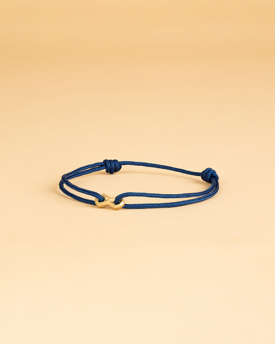Blue nylon bracelet with a gold-plated infinity sign