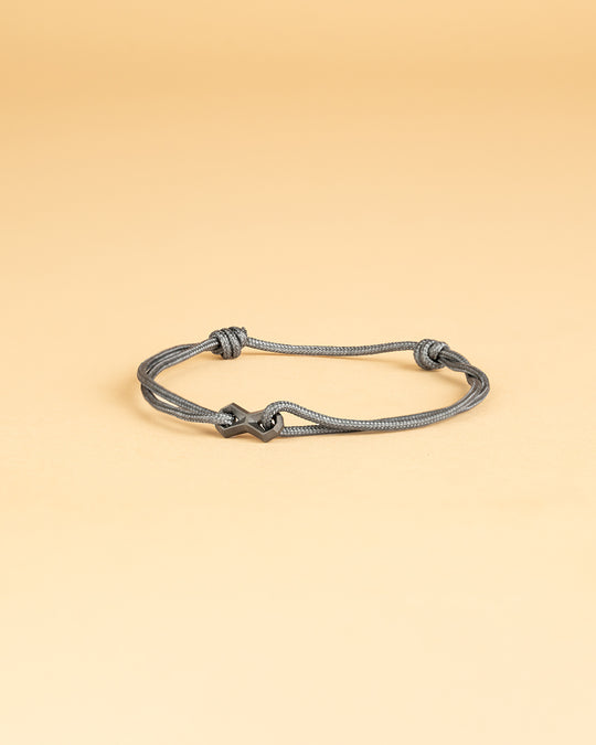 Bracelet en nylon gris avec un signe infini noir