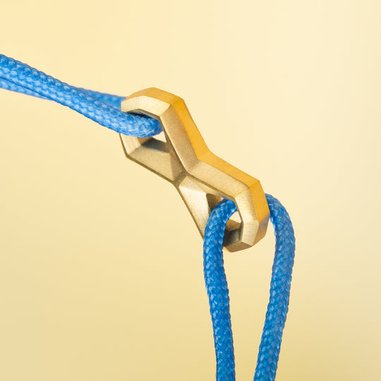 Light blue nylon bracelet with a titanium infinity sign