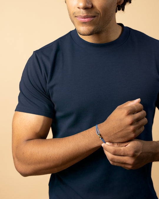 Light blue nylon bracelet with a titanium infinity sign