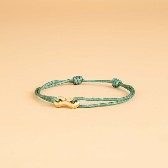 Green nylon bracelet with a titanium Infinity sign
