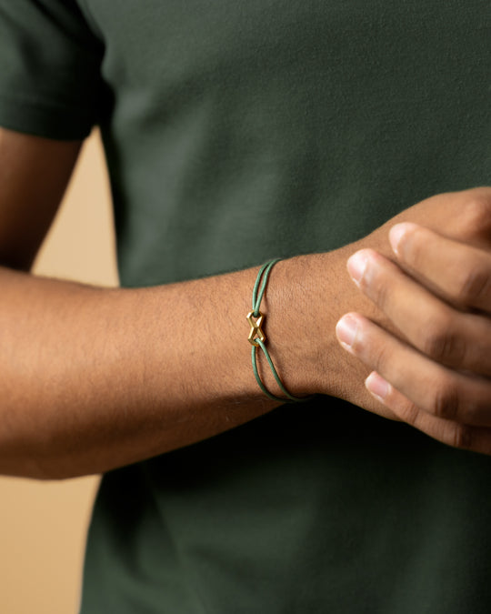 Green nylon bracelet with a titanium Infinity sign