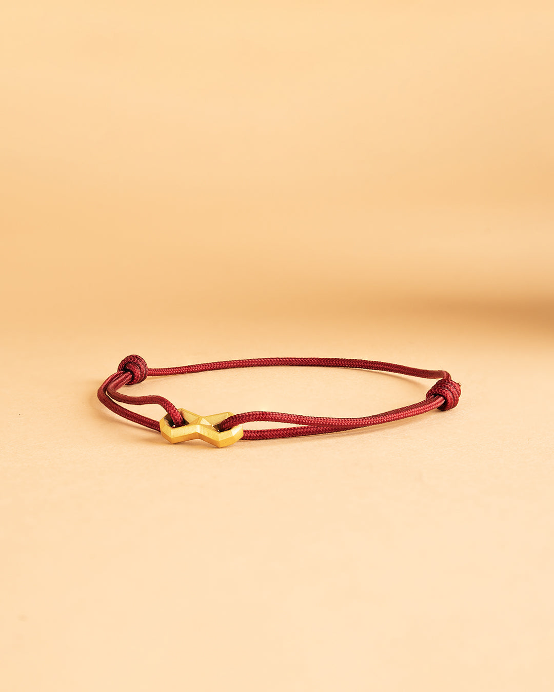 1.5mm Bordeaux nylon bracelet with a titanium Infinity sign