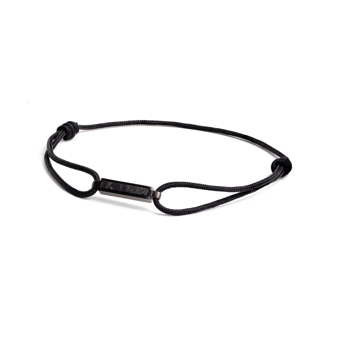 Black nylon bracelet with a black carbon element