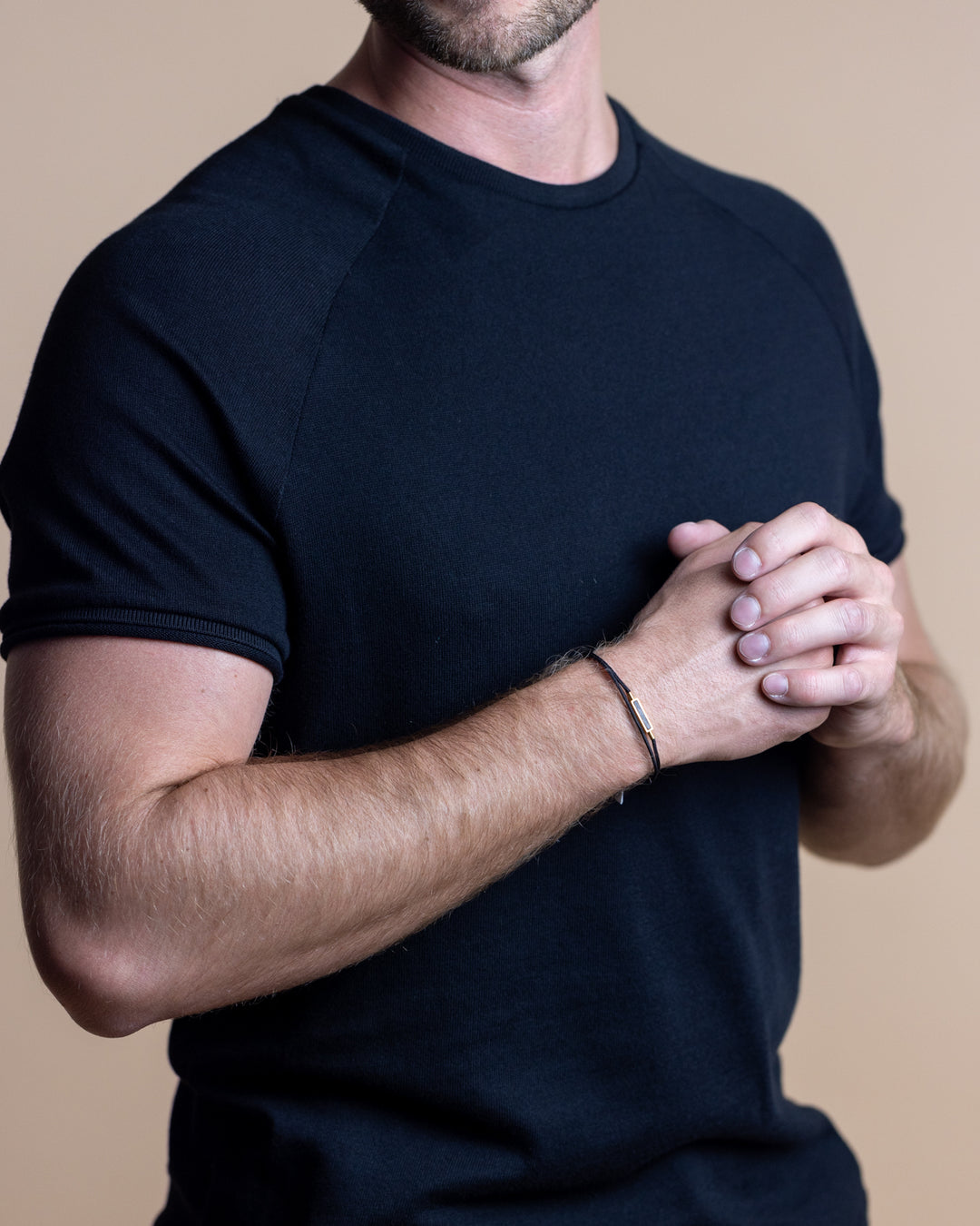 Black nylon bracelet with a gold-plated carbon element