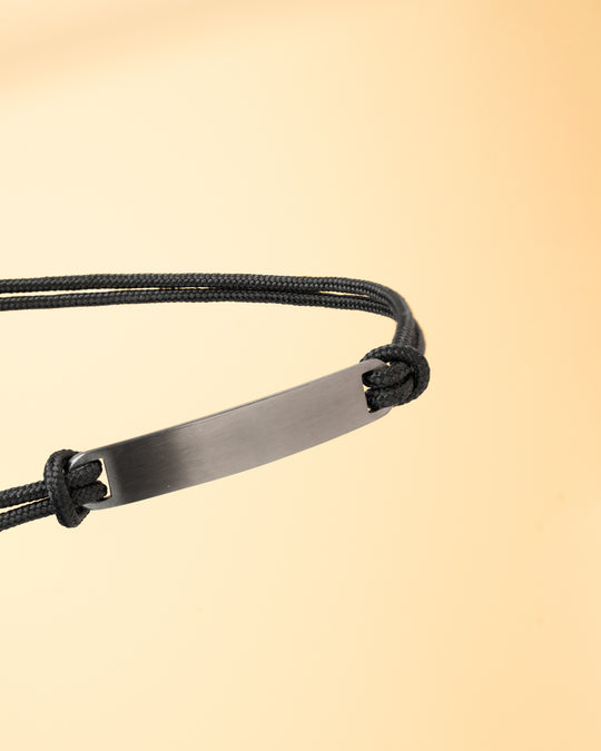 Black nylon bracelet with a black engraving plate