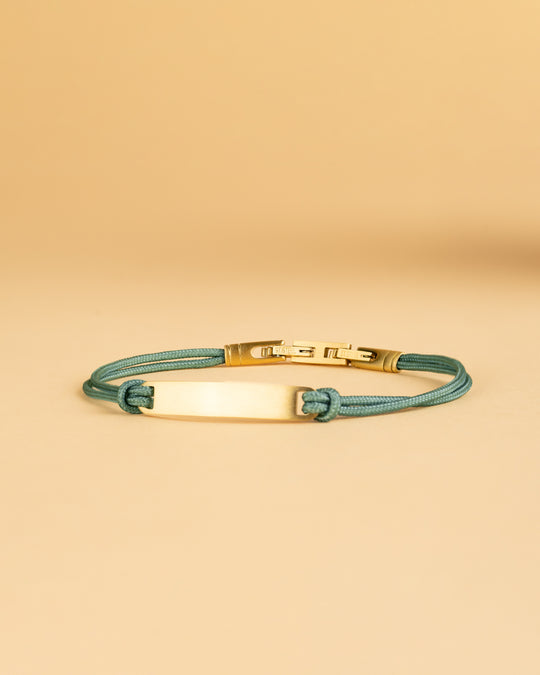 Green nylon bracelet with a gold-plated engraving plate