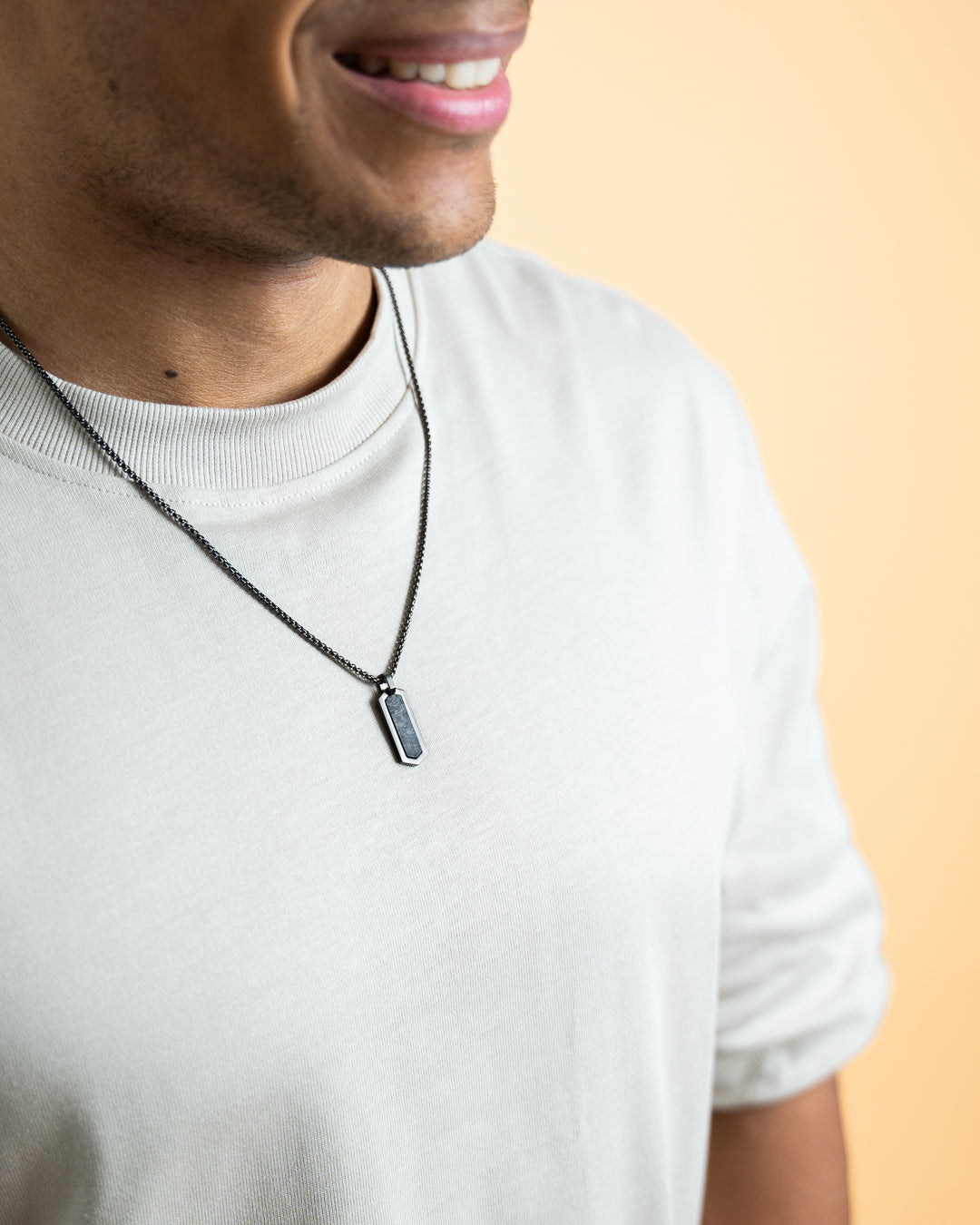 Black stainless steel necklace with a forged carbon finish