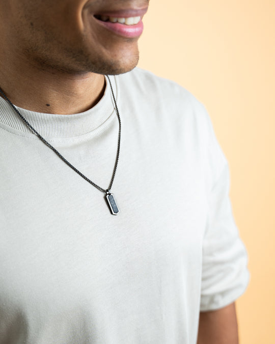 Black stainless steel necklace with a forged carbon finish