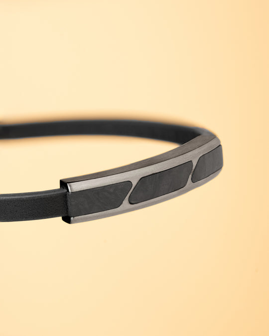 Black leather bracelet finished with forged carbon