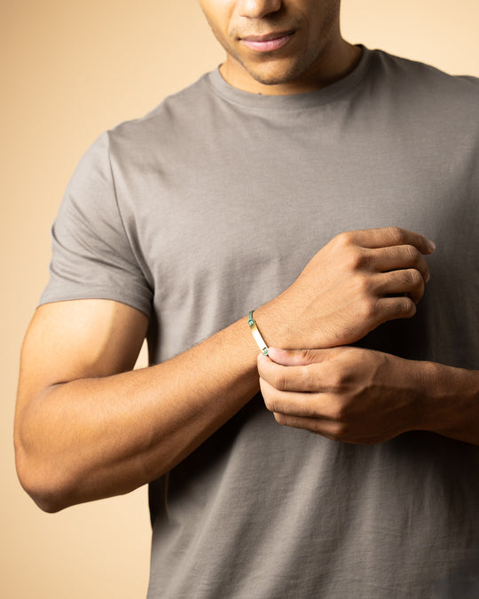 Green nylon bracelet with a gold-plated engraving plate