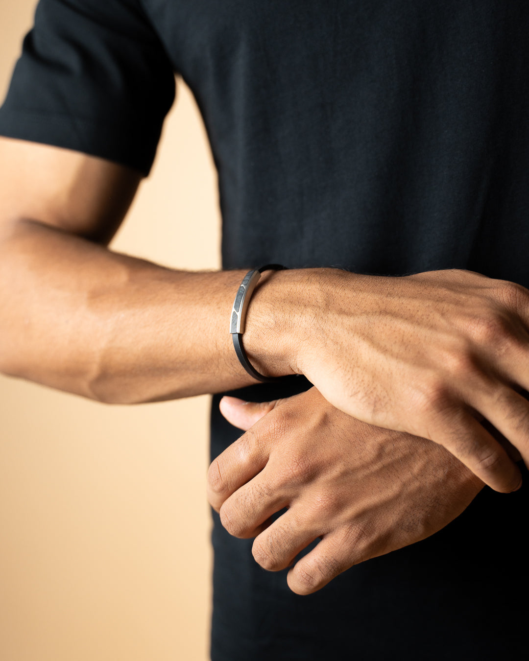 Black leather bracelet with forged carbon