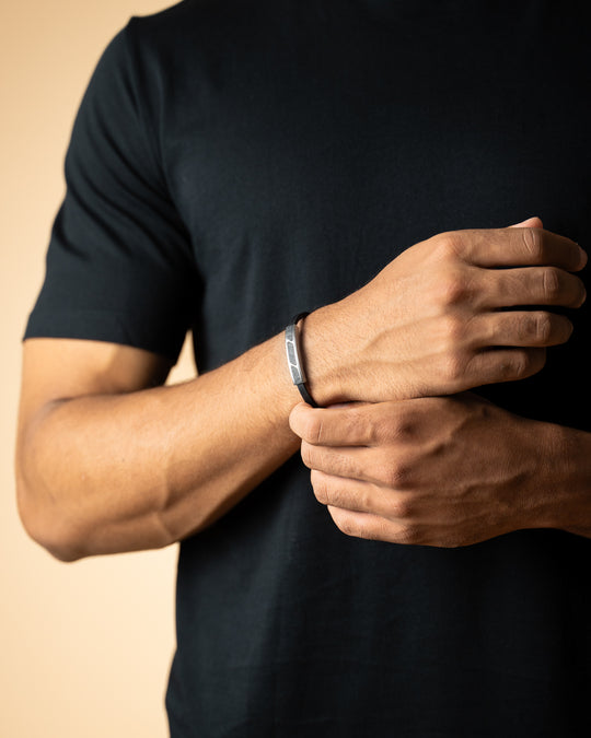 Black leather bracelet with forged carbon