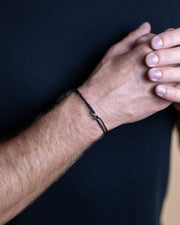 1.5mm Black nylon bracelet with a silver Infinity sign