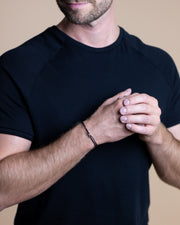 Bracelet en nylon noir de 1,5 mm avec un signe Infinity argenté