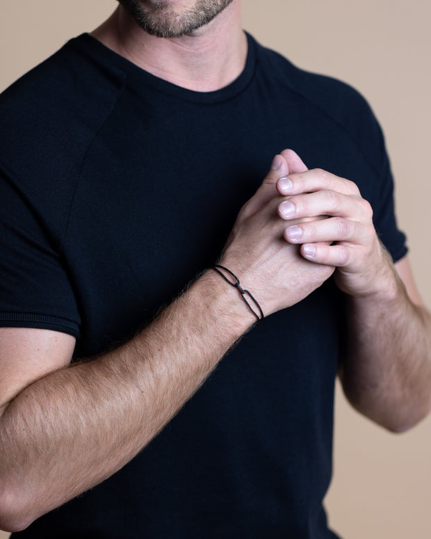 1.5mm Black nylon bracelet with a black Infinity sign
