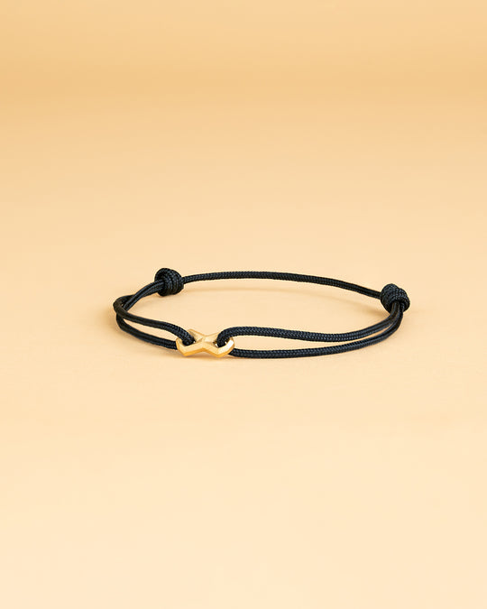 Black nylon bracelet with a gold-plated infinity sign