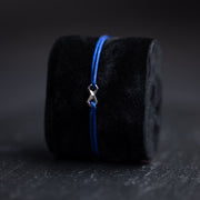 1,5 mm blauwe nylon armband met een verzilverd Infinity-teken