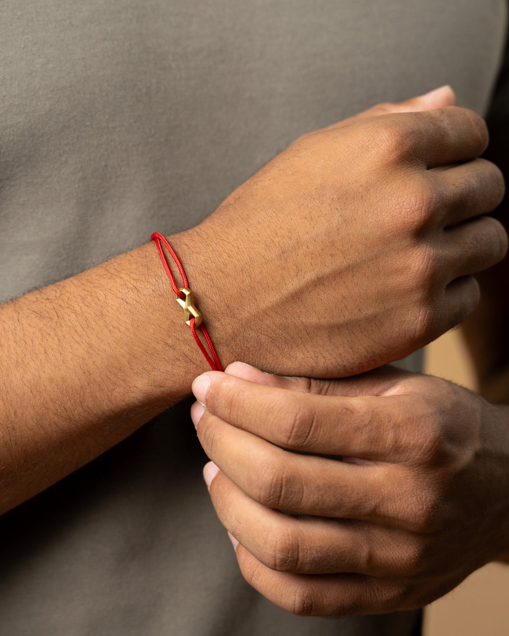 1.5mm Red nylon bracelet with a titanium Infinity sign
