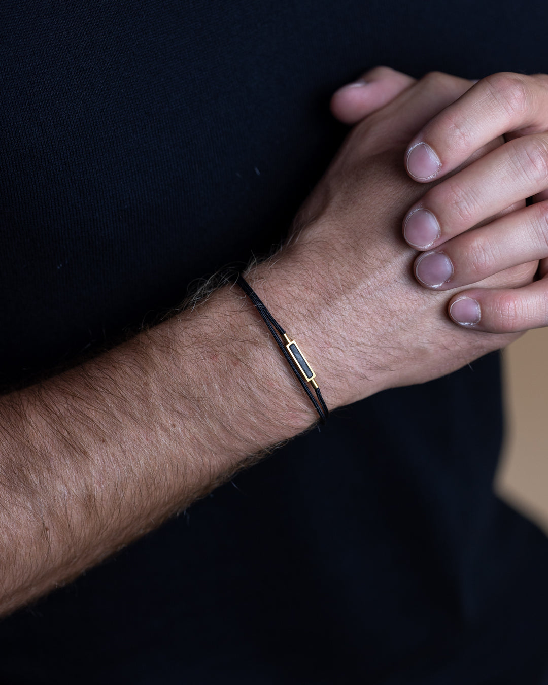 1.5mm Black nylon bracelet with a gold-plated carbon element