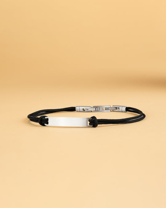 1.5mm black nylon bracelet with a silver stainless steel closing and engraving plate