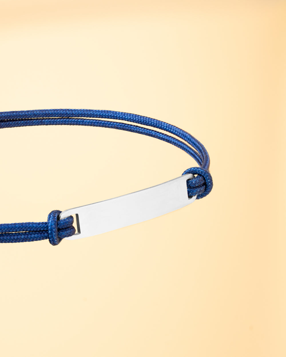 1.5mm blue nylon bracelet with a stainless steel closing and engraving plate