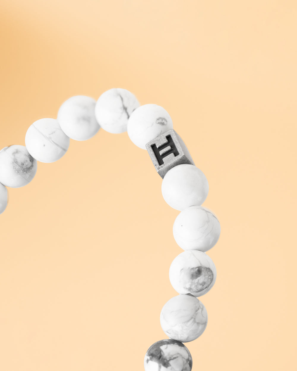 Cross bracelet with 8mm white Howlite stone