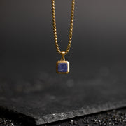Titanium/stalen collier met een 18kt gouden afwerking en Lapis Lazuli steen