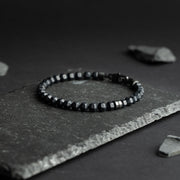 Bracelet with 6mm matte Black Agate stone and titanium element