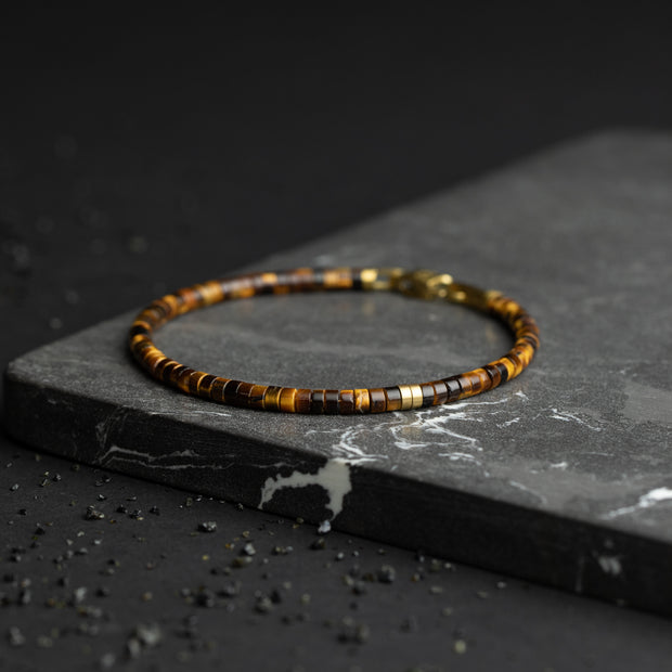 Bracelet 2 mm avec pierres en œil de tigre et élément en titane