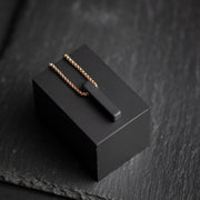 Bronskleurige halsketting met een zwarte Agaat steen