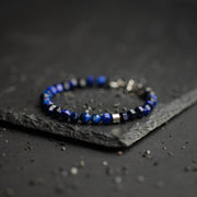 Bracelet avec pierre en Oeil de Tigre bleu de 6 mm et élément en titane
